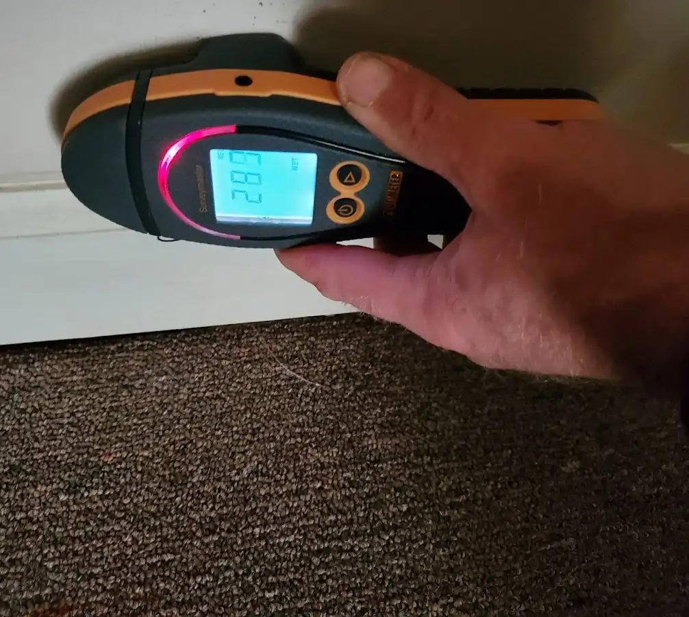 Moisture detection at baseboard during Storm Damage Restoration in Upper Deerfield